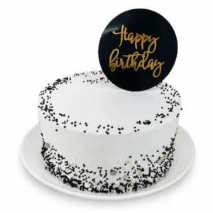 vanila sponge cake layered decorated with black and white confetti