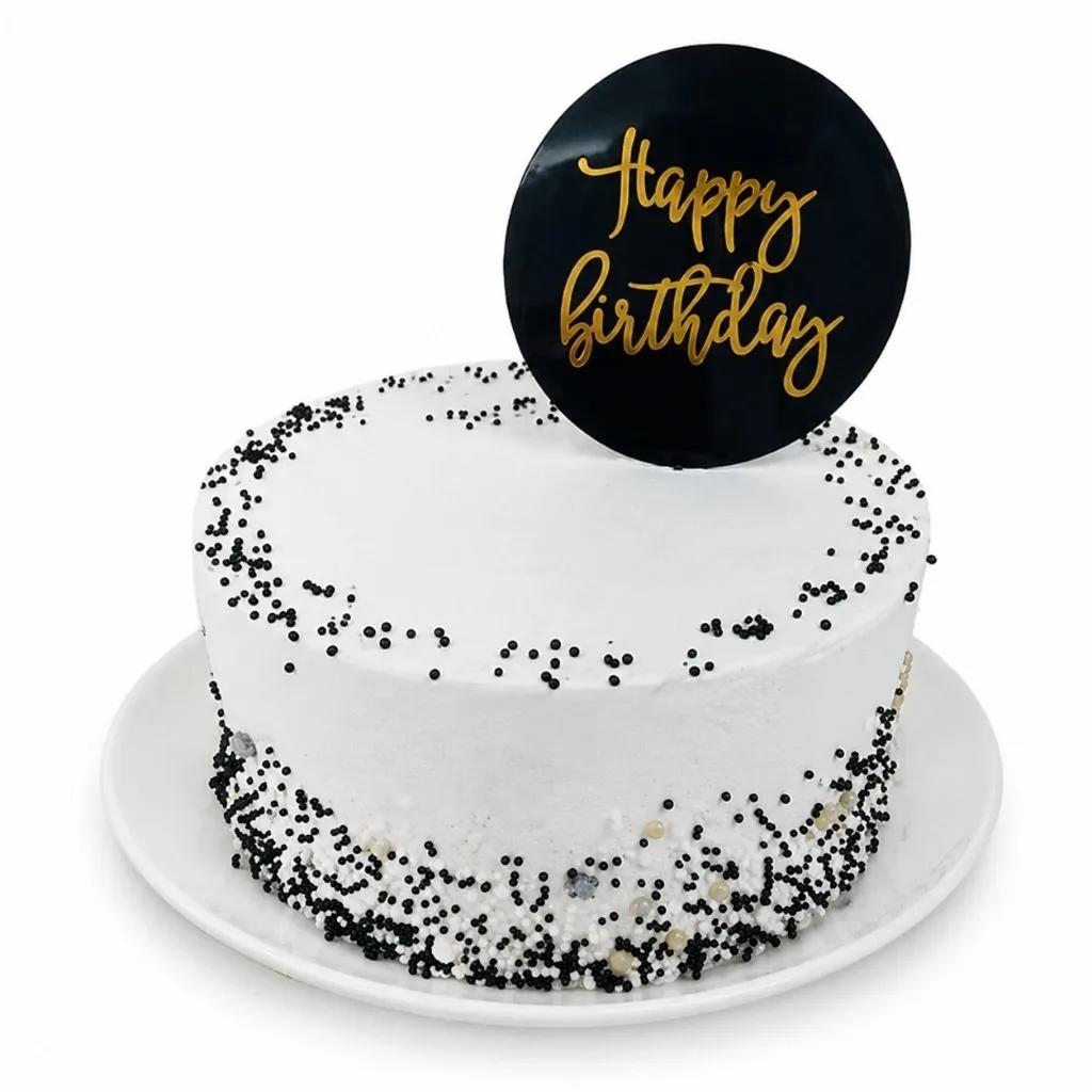vanila sponge cake layered decorated with black and white confetti